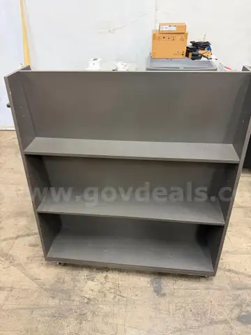 Two-sided Triangle shaped book shelf with three shelves