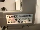 SMART BOARD MODEL 680 WITH HANGING RACKS ON WHEELS