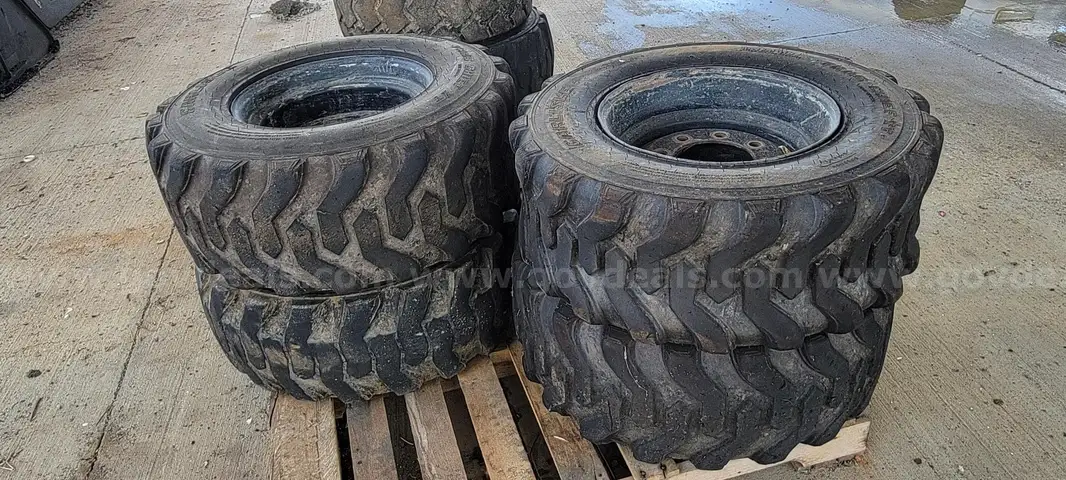 4 SKID STEER TIRES AND WHEELS