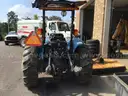 (1) USED 2000 NEW HOLLAND TN65 TRACTOR W/SIDE-ARM MOWER