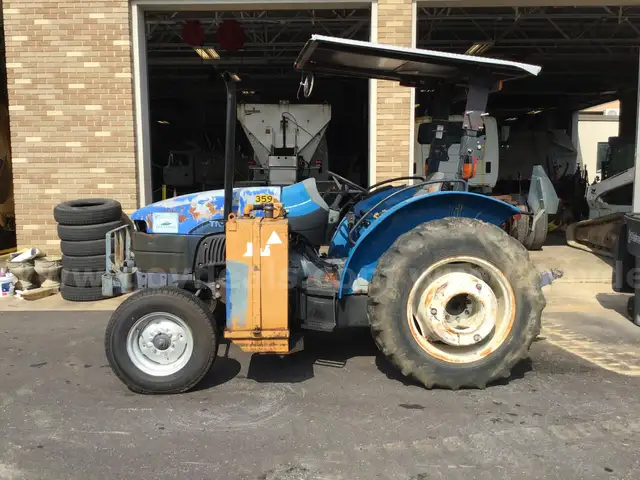 (1) USED 2000 NEW HOLLAND TN65 TRACTOR W/SIDE-ARM MOWER