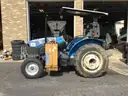 (1) USED 2000 NEW HOLLAND TN65 TRACTOR W/SIDE-ARM MOWER