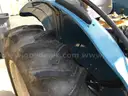 (1) USED 2000 NEW HOLLAND TN65 TRACTOR W/SIDE-ARM MOWER
