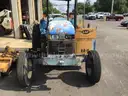 (1) USED 2000 NEW HOLLAND TN65 TRACTOR W/SIDE-ARM MOWER