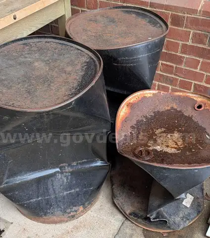 55 gallon steel drums, collapsed, <2026FEB23-1>
