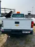 Four (4) Chevrolet Trucks