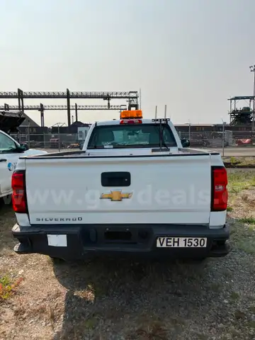 Four (4) Chevrolet Trucks
