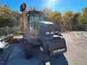 John Deere 6615 Tractor with ALAMO Industrial 60 Inch Rotary Bushhog with 30 foot boom