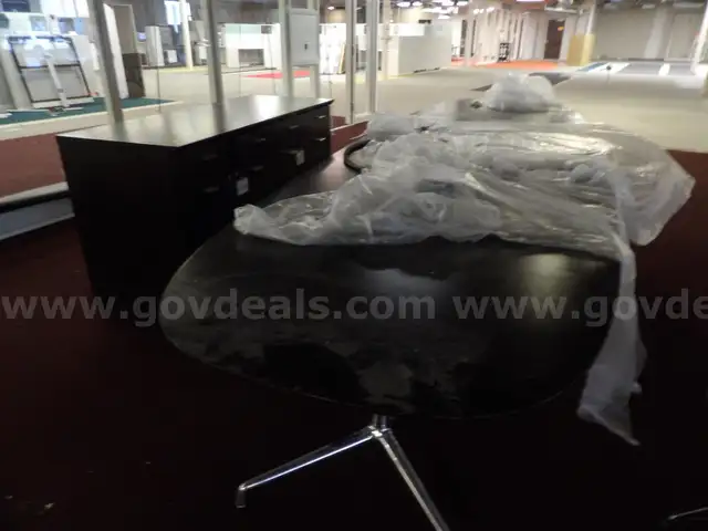 Long Conference Table with Power Plugs and Additional Storage