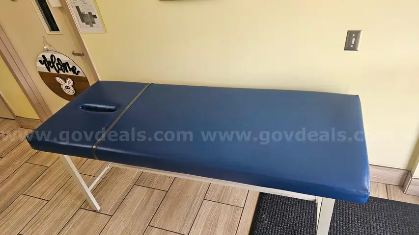 Two Winco model 851 treatment table
