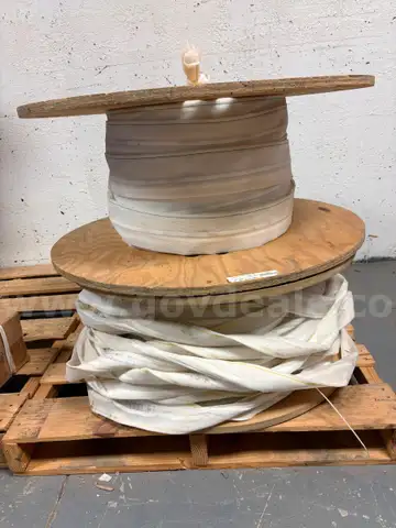 2 white cable spools