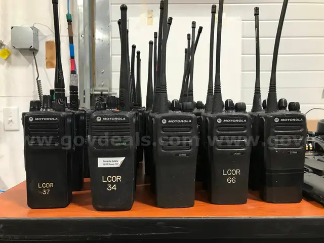 Lot of 29  LOCKED Motorola radios and chargers