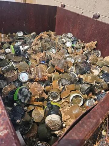 large bin of Brass water meters
