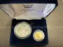 Ten Dollar Gold Coin and Silver Dollar