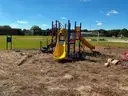 Playground structure with various steps, ladders, steps, slides etc