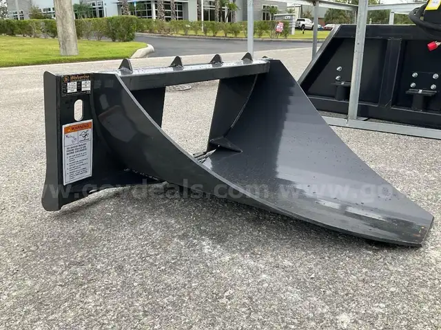 UNUSED 2025 WOLVERINE TREE DIGGER ATTACHMENT MODEL TD-13-36R FOR UNIVERSAL SKID STEER