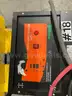 RICO ELECTRIC PALLET JACK MODEL PWH-150 WITH GREEN ENERGY BATTERY CHARGER MODEL OD12-0550-C