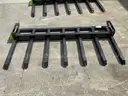 UNUSED PALLET FORKS W/ 7TEETH ATTACHMENT FOR UNIVERSAL SKID STEER, 69 in W