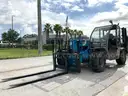 2014 GENIE TELEHANDLER MODEL GTH-5519; DIESEL POWERED; APPROX MAX LIFT CAPACITY W/ PALADIN ATTACHMENT