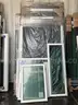 UNUSED LOT OF ASSORTED SCREENS / DOORS &#x26; WINDOWS