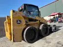 JOHN DEERE SKID STEER MODEL 315, DIESEL, ENCLOSED CAB , UNUSED ROLLER ATTACHMENT, SMOOTH TIRES, RUNS AND OPERATES