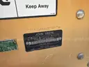 JOHN DEERE SKID STEER MODEL 315, DIESEL, ENCLOSED CAB , UNUSED ROLLER ATTACHMENT, SMOOTH TIRES, RUNS AND OPERATES