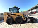 JOHN DEERE SKID STEER MODEL 315, DIESEL, ENCLOSED CAB , UNUSED ROLLER ATTACHMENT, SMOOTH TIRES, RUNS AND OPERATES