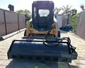JOHN DEERE SKID STEER MODEL 315, DIESEL, ENCLOSED CAB , UNUSED ROLLER ATTACHMENT, SMOOTH TIRES, RUNS AND OPERATES