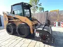 JOHN DEERE SKID STEER MODEL 315, DIESEL, ENCLOSED CAB , UNUSED ROLLER ATTACHMENT, SMOOTH TIRES, RUNS AND OPERATES