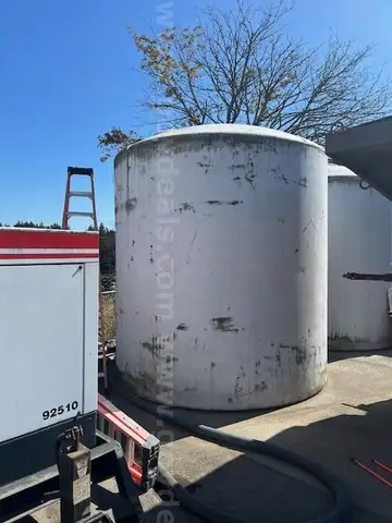 (2) 6100-gallon vertical liquid storage tanks