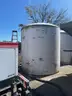 (2) 6100-gallon vertical liquid storage tanks