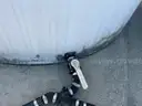 (2) 6100-gallon vertical liquid storage tanks