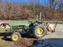 John Deere 830 Tractor with three-point sprayer