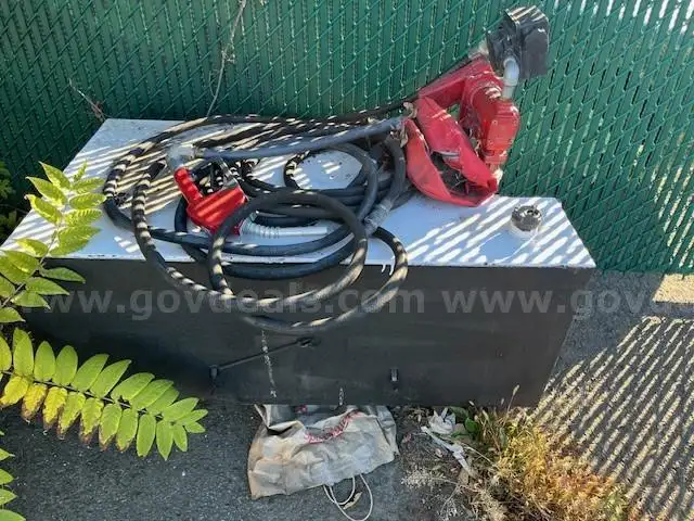 100 gal. fuel transfer tank with 12 volt pump.