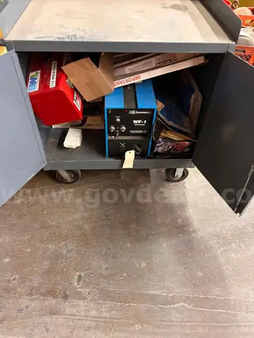 Gray metal cabinet FULL of tig welding equipment