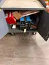 Gray metal cabinet FULL of tig welding equipment