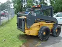 2005 New Holland LS180 Skid Loader - Out Side Gated Lot Gate 1