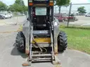 2005 New Holland LS180 Skid Loader - Out Side Gated Lot Gate 1