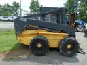 2005 New Holland LS180 Skid Loader - Out Side Gated Lot Gate 1