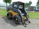 2005 New Holland LS180 Skid Loader - Out Side Gated Lot Gate 1