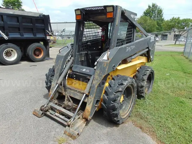 2005 New Holland LS180 Skid Loader - Out Side Gated Lot Gate 1