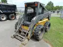 2005 New Holland LS180 Skid Loader - Out Side Gated Lot Gate 1