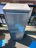 two drawer metal container with plastic bins in each drawer