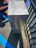 two drawer metal container with plastic bins in each drawer