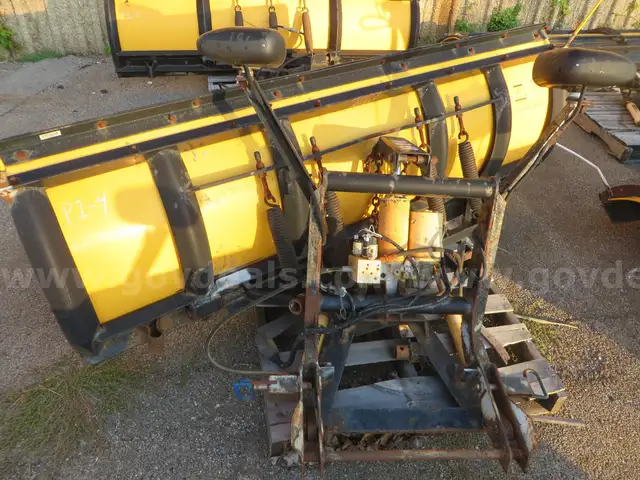 Meyer snow-plow with attachment and hydraulics.