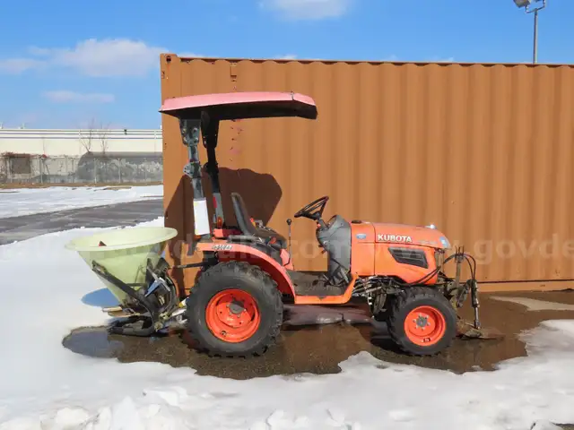 Kubota Tractor with Salt Spreader and attachment for a Plow