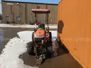 Kubota Tractor with Salt Spreader and attachment for a Plow