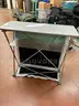 Lot of 8 collapsible standing height tables with velcro swappable fronts