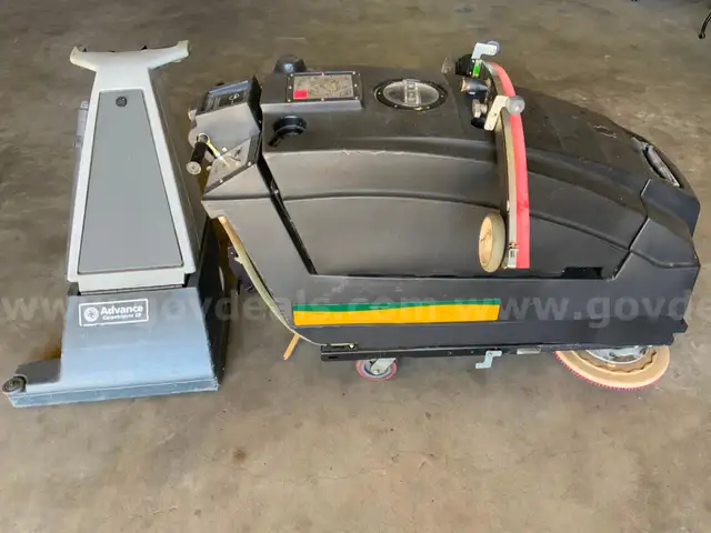 1 WRANGLER AUTO SCRUBBER MACHINE , 1 ADVANCE 28’’ WIDE AREA UPRIGHT VACUUM CLEANER AND 25 CHAIRS.