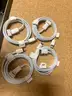 A Package of New iPhone Covers, Cases, Wall Charge Adapters, USB Cables